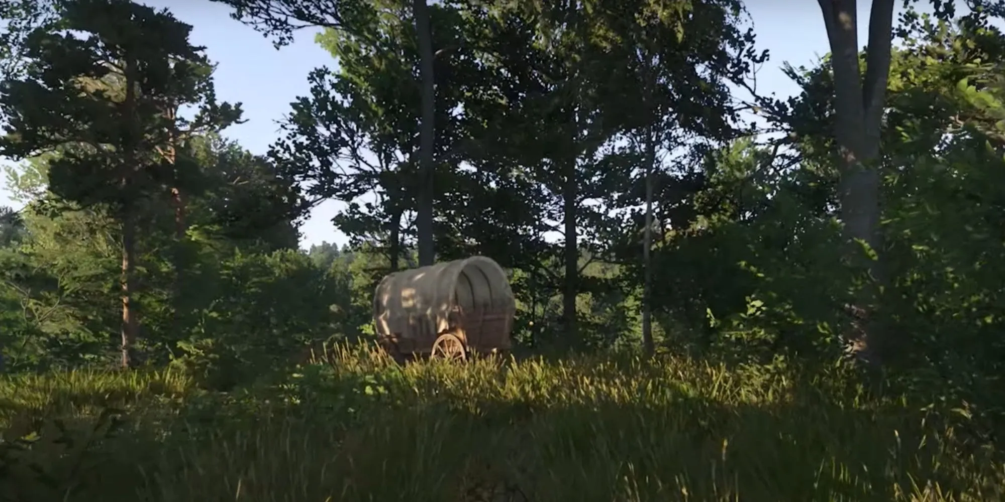Một cảnh trong Kingdom Come Deliverance 2 cho thấy xe ngựa và các công trình thời Trung Cổ, minh họa cho thế giới chi tiết của game