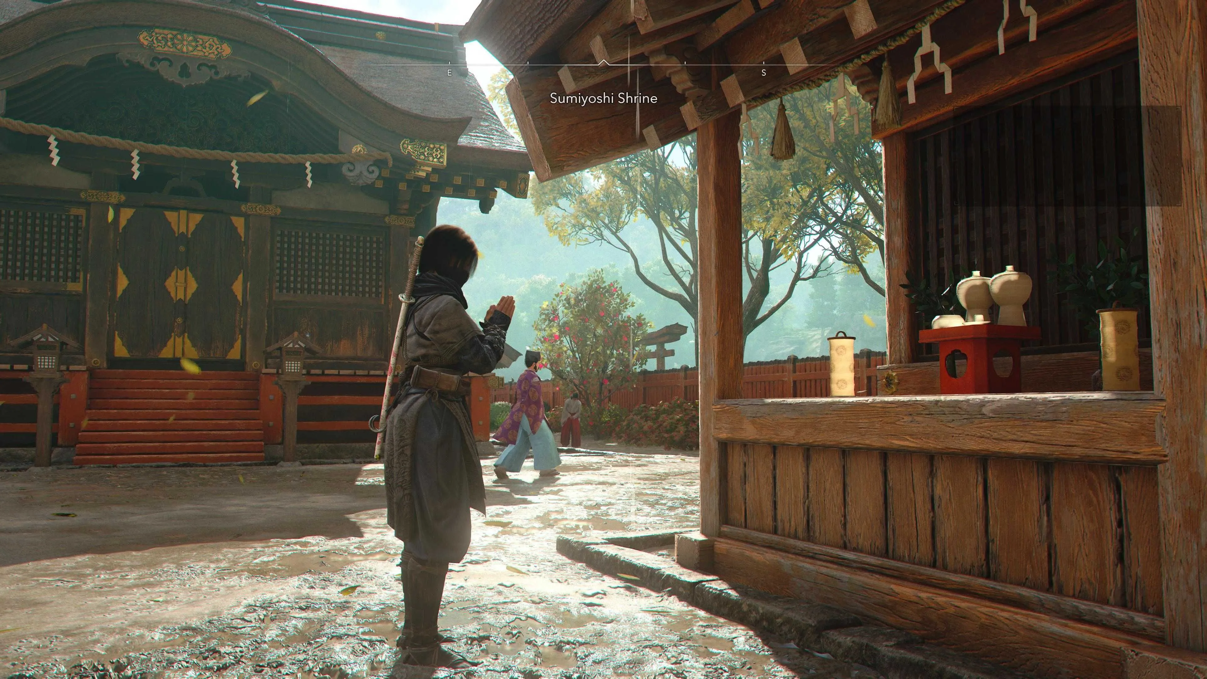 Nhân vật đang cầu nguyện tại một ngôi đền cổ kính trong Assassin's Creed Shadows để nhận điểm tri thức