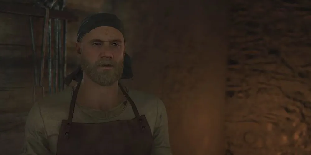 Thợ rèn Radovan đang làm việc trong Kingdom Come Deliverance 2