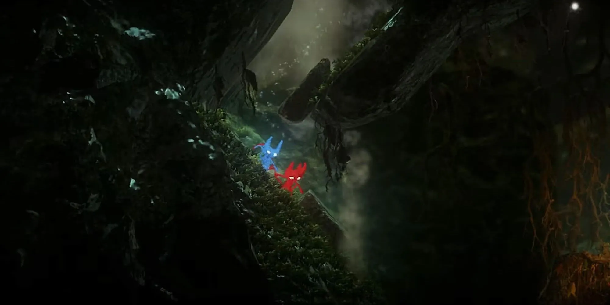 Cẩn thận trèo xuống gờ đá trong game co-op Unravel Two