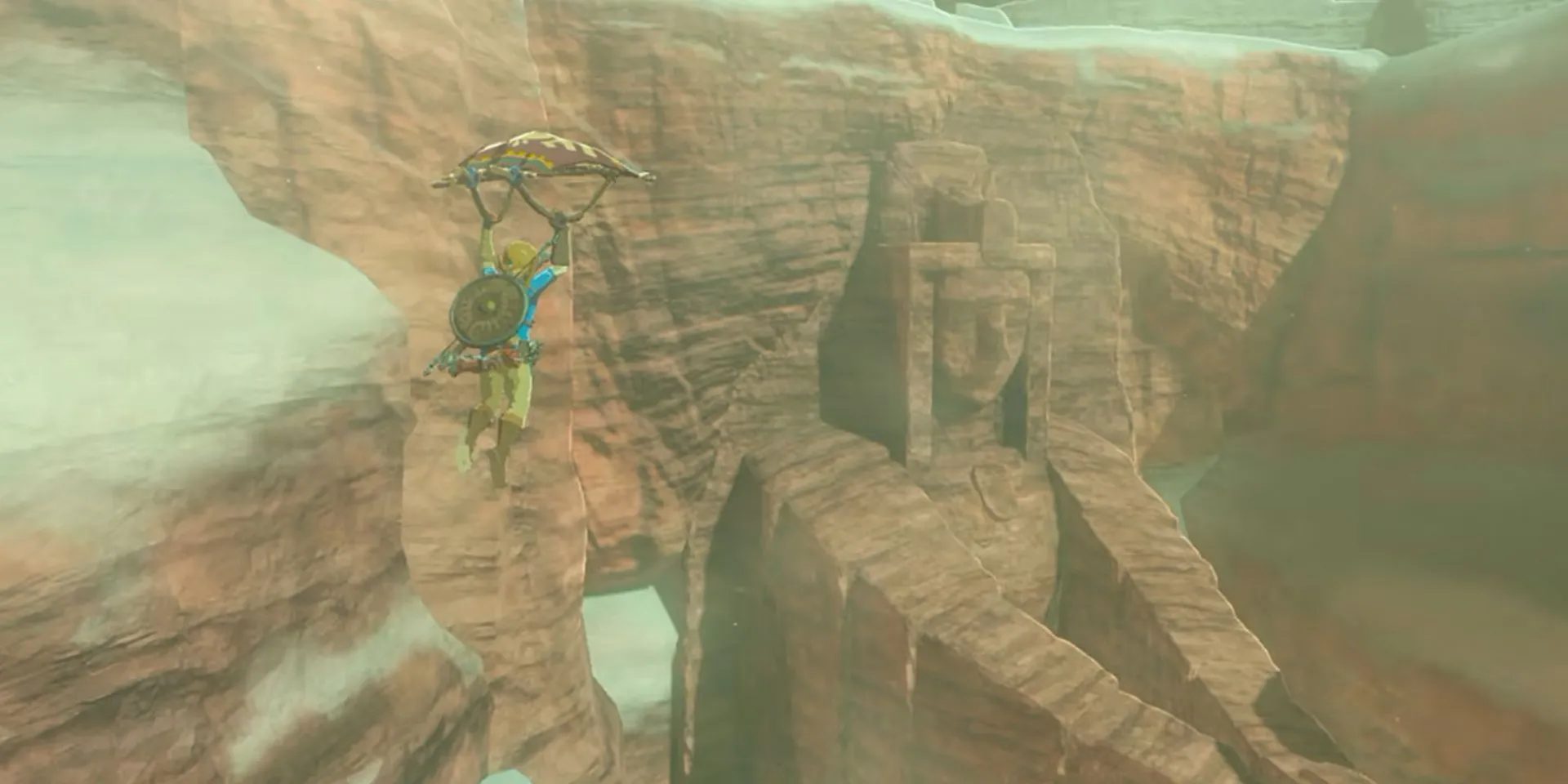 Link lướt dù về phía tàn tích trong The Legend of Zelda: Breath of the Wild