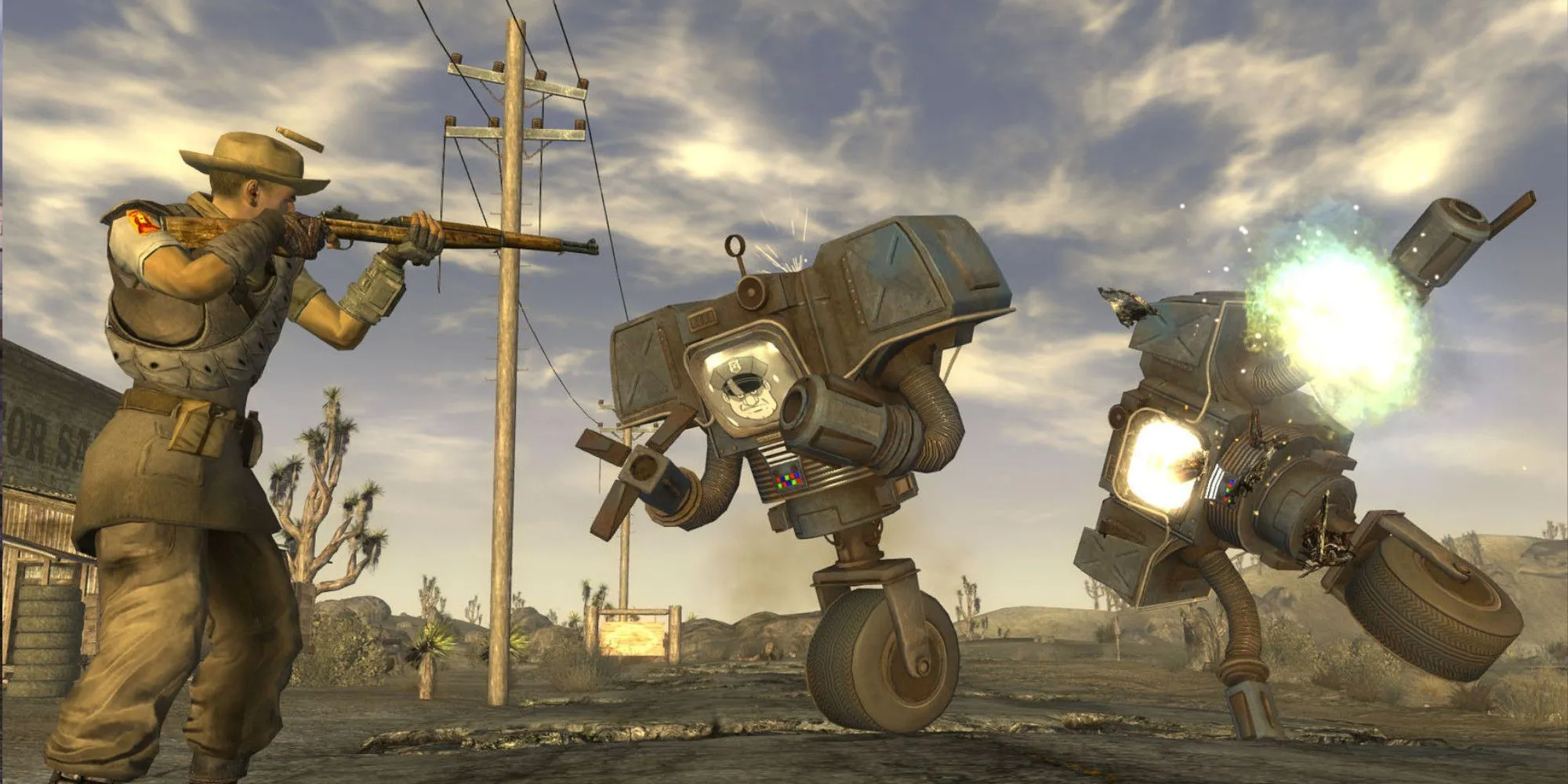 Nhân vật trong Fallout New Vegas chĩa vũ khí vào máy móc.
