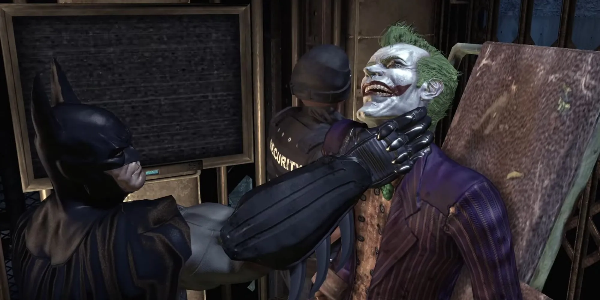 Batman giữ cổ Joker khi hắn bị vận chuyển đến phòng giam trong Batman Arkham Asylum