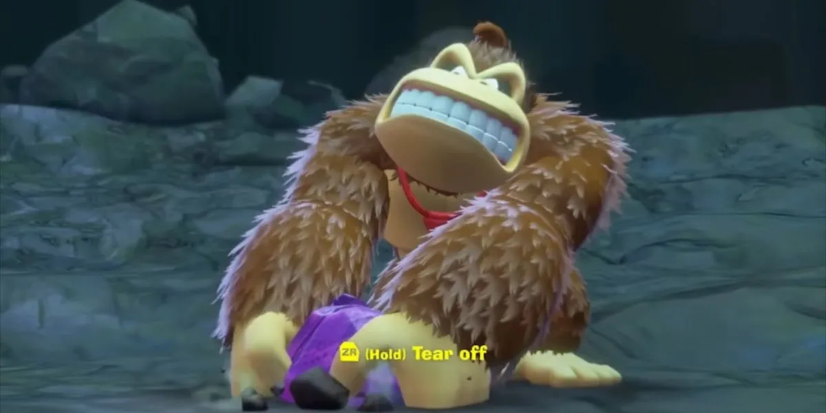Donkey Kong nhấc một mảnh địa hình, minh họa kỹ năng &quot;Tear Off Chunks&quot; đa dụng