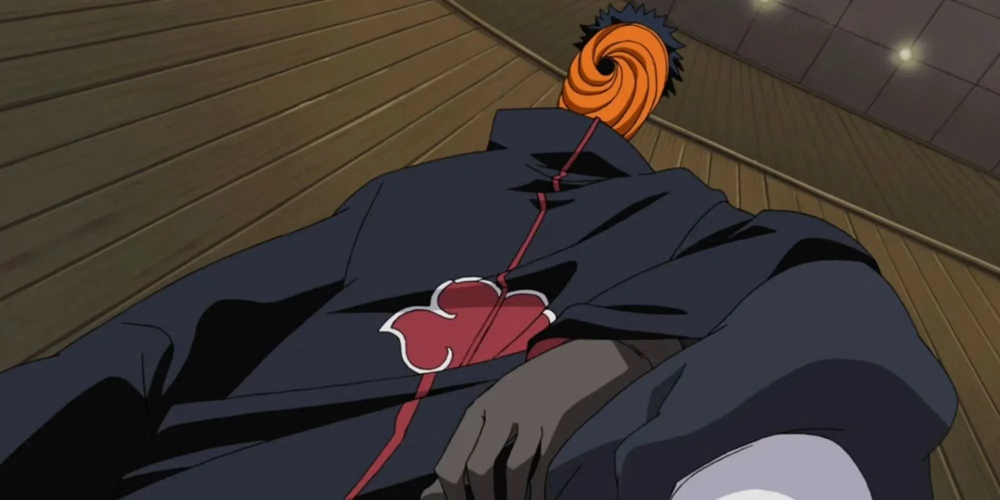 Obito Uchiha với Mangekyo Sharingan, biểu tượng của Kế hoạch Nguyệt Nhãn, một âm mưu vĩ đại nhưng khó tin lại không bị phát hiện sớm hơn trong Naruto
